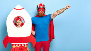 centacare-wagga-course-autism-is-my-superpower-picture-shows-dad-daughter-dressed-superheros-in-spaceship